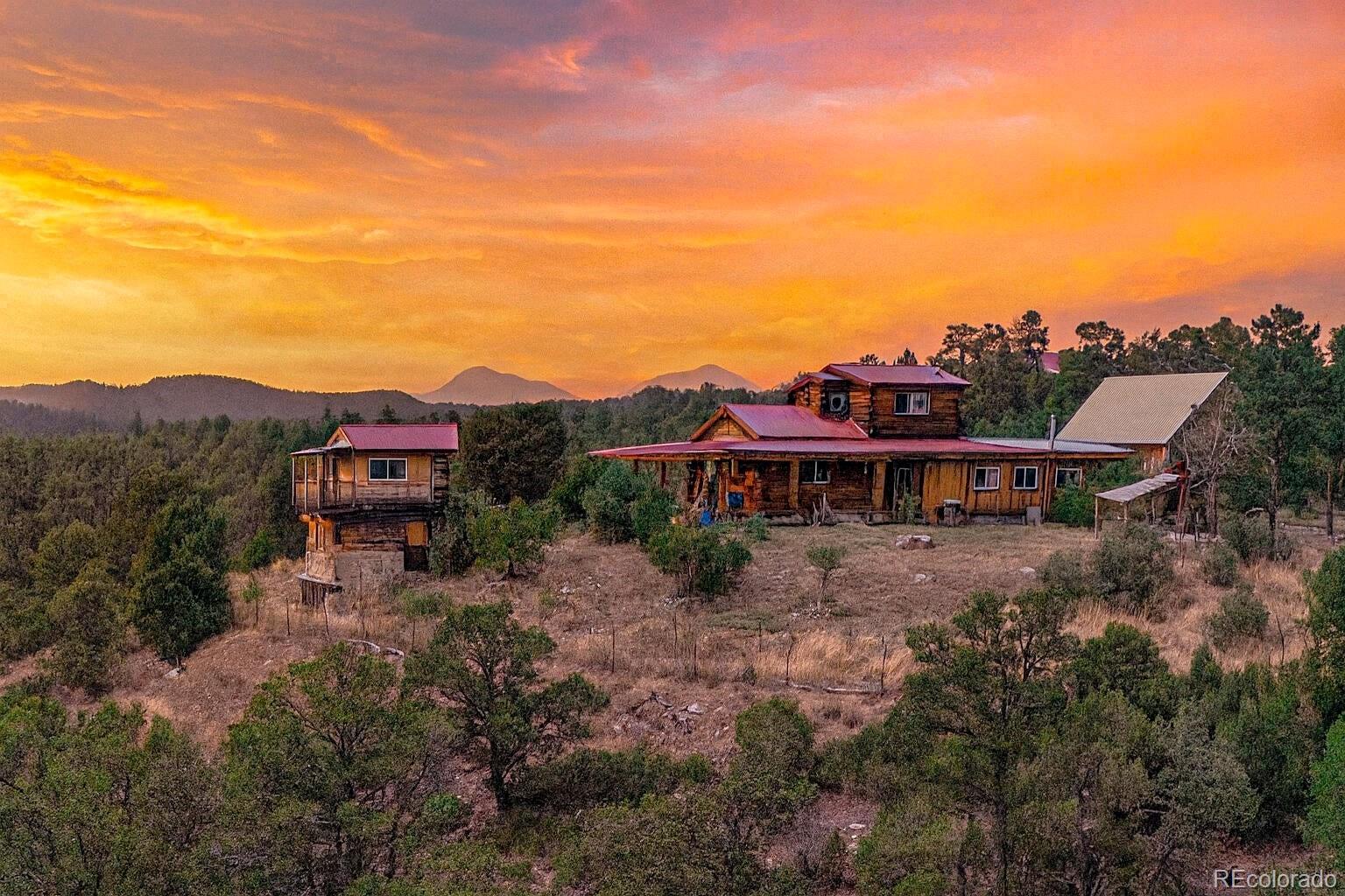 a view of a house with a yard and balcony