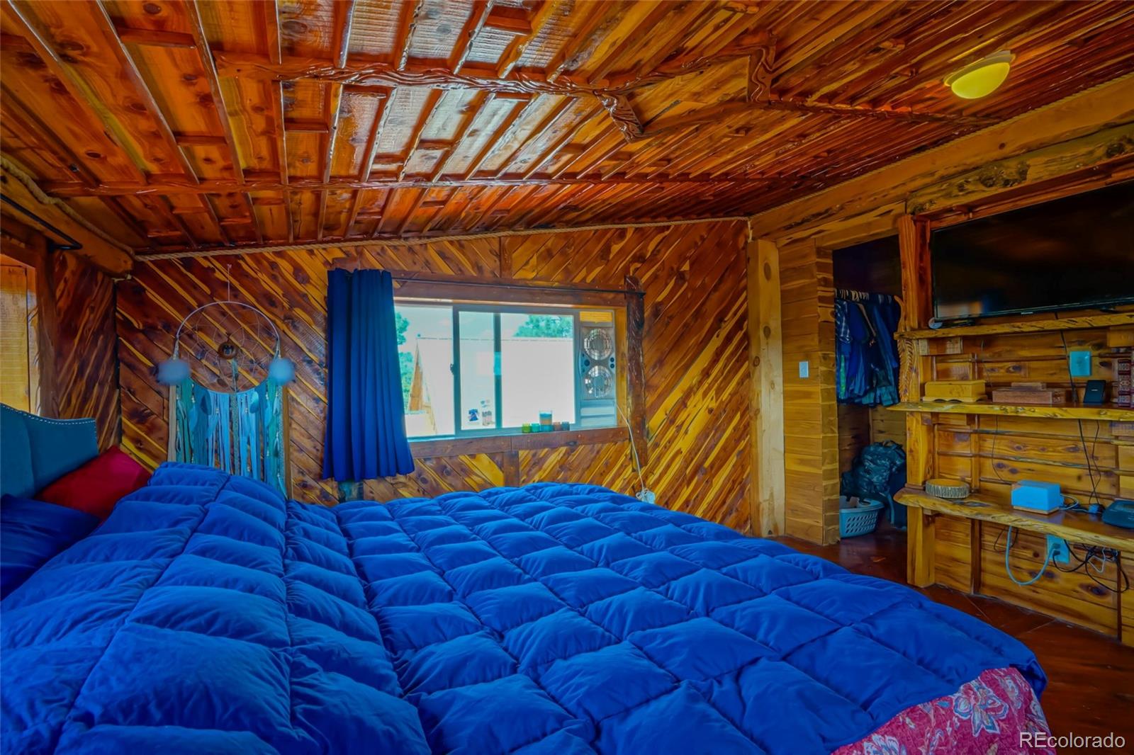 31300 Timber Canyon Road Trinidad, CO 81082 - Photo 31 of 50 a blue bed sitting in front of a room