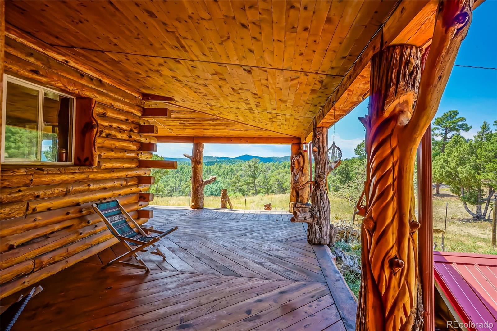 31300 Timber Canyon Road Trinidad, CO 81082 - Photo 35 of 50 a view of a chairs and bench in the backyard