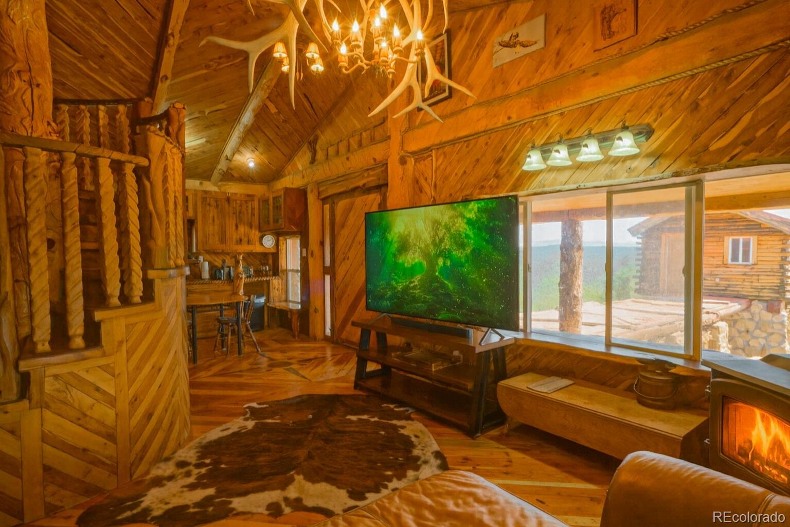 31300 Timber Canyon Road Trinidad, CO 81082 - Photo 7 of 50 a living room with furniture and a flat screen tv