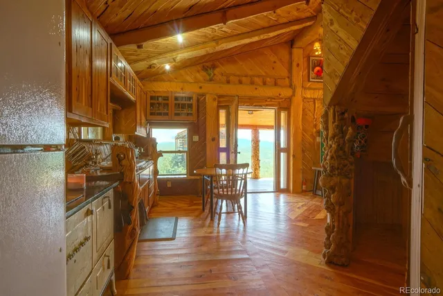 a view of a entryway with furniture and wooden floor