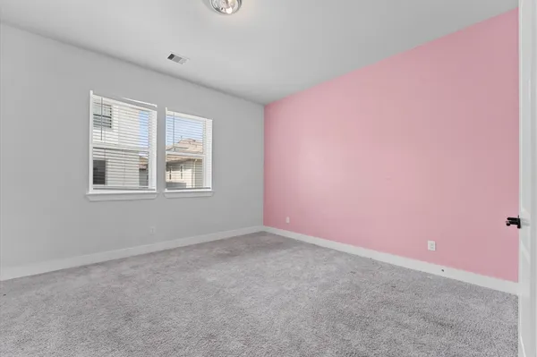 a view of empty room with windows
