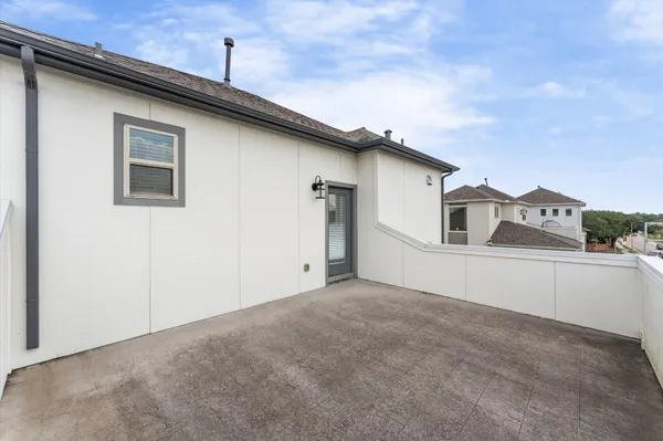 a view of a kitchen with wooden floor and windows