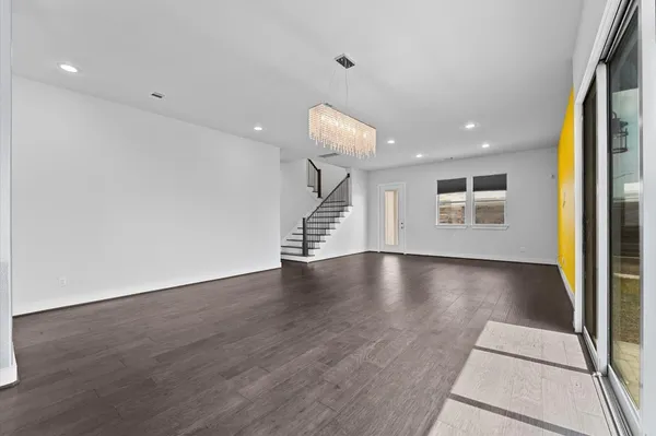 a view of livingroom with hardwood floor and hallway