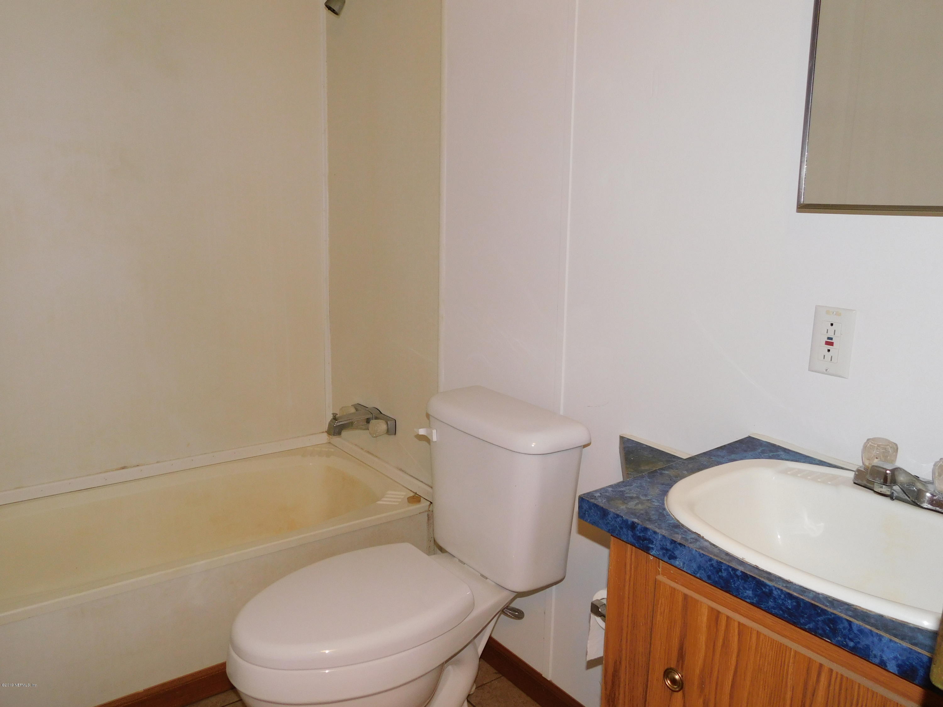 112 Cindy Street Interlachen, FL 32148 - Photo 20 of 33 a white toilet and a sink