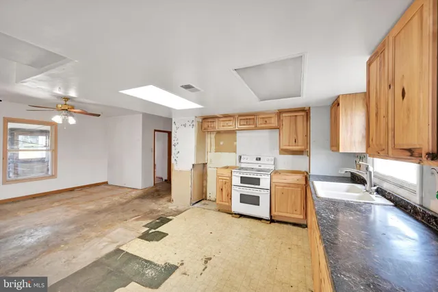 a large bathroom with a large tub and sink