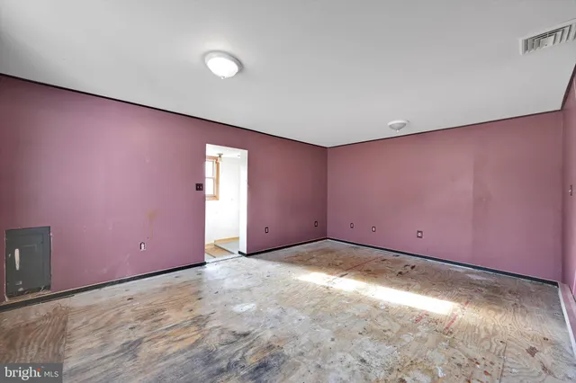 a bathroom with a tub shower and mirror