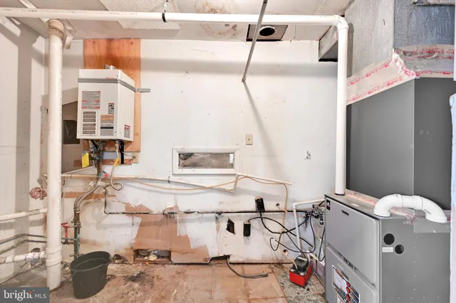 a view of a backyard with chair and wooden fence