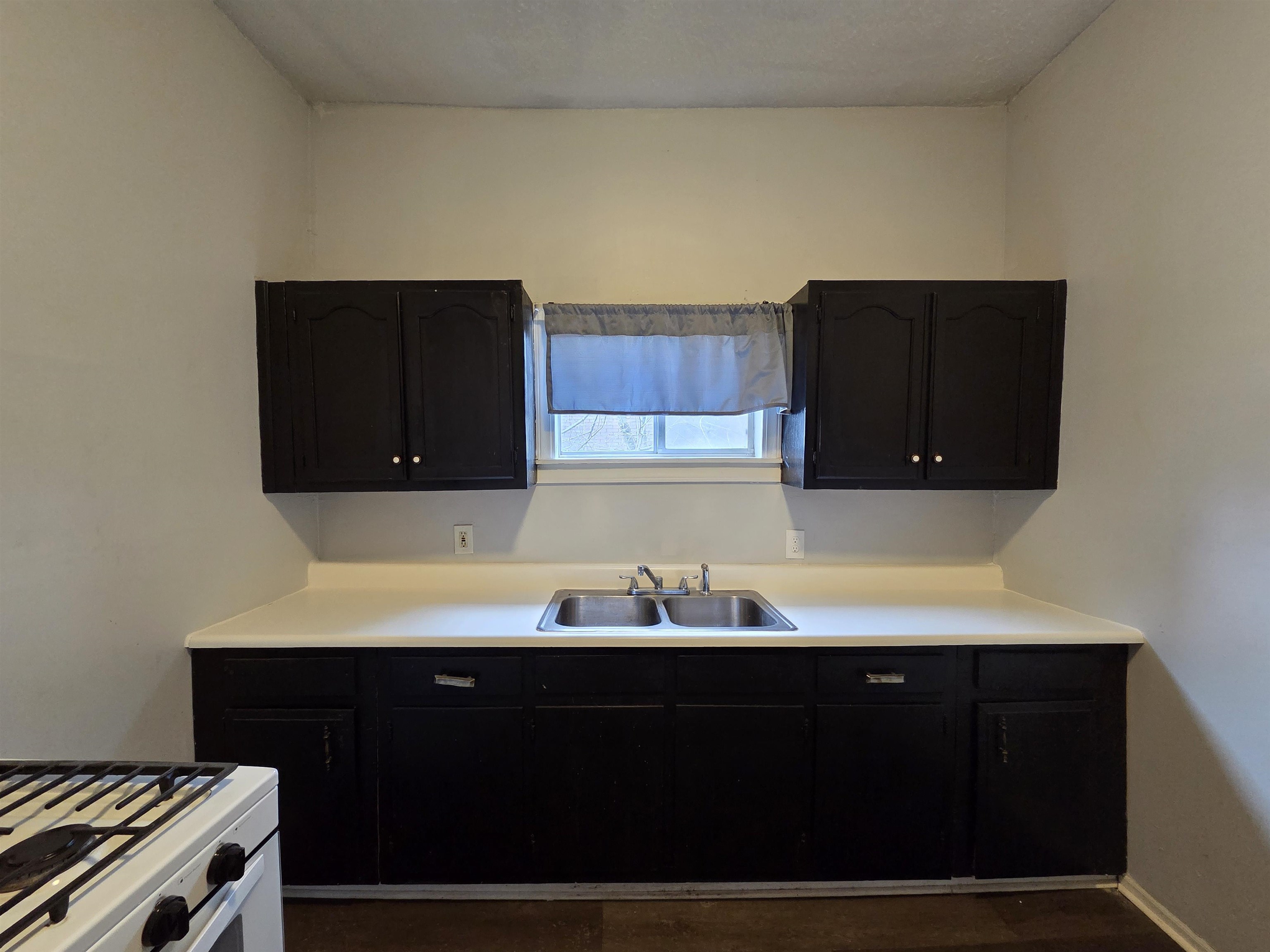 993 Oakview Street, Unit 201 Memphis, TN 38114 - Photo 13 of 16 a view of cabinets and wooden floor