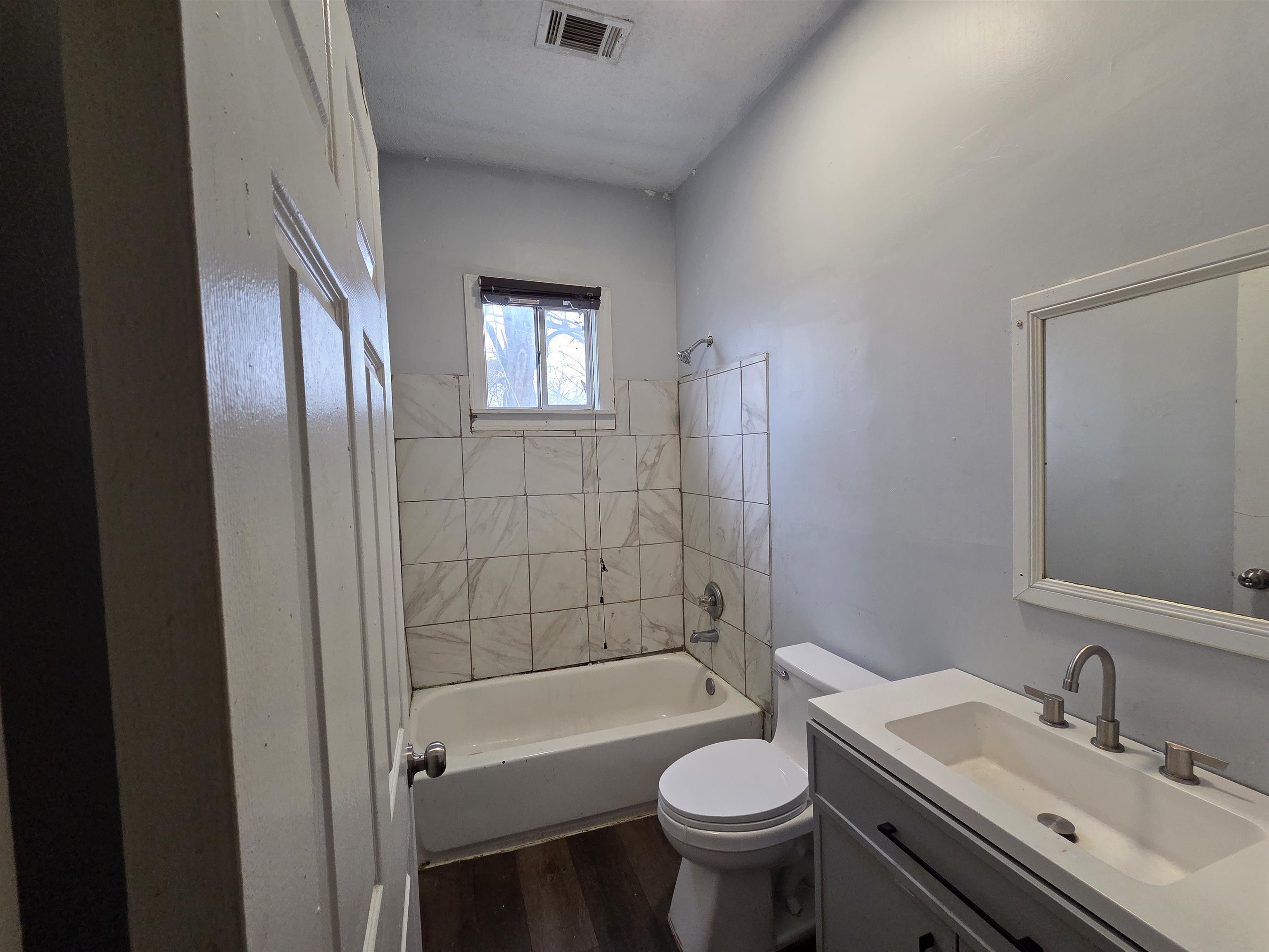 993 Oakview Street, Unit 201 Memphis, TN 38114 - Photo 15 of 16 a bathroom with a sink and a mirror