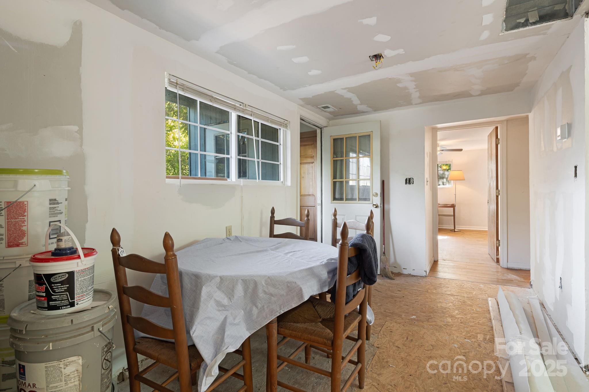609 Maple Street Brevard, NC 28712 - Photo 14 of 28 a view of a dining room with furniture and a window