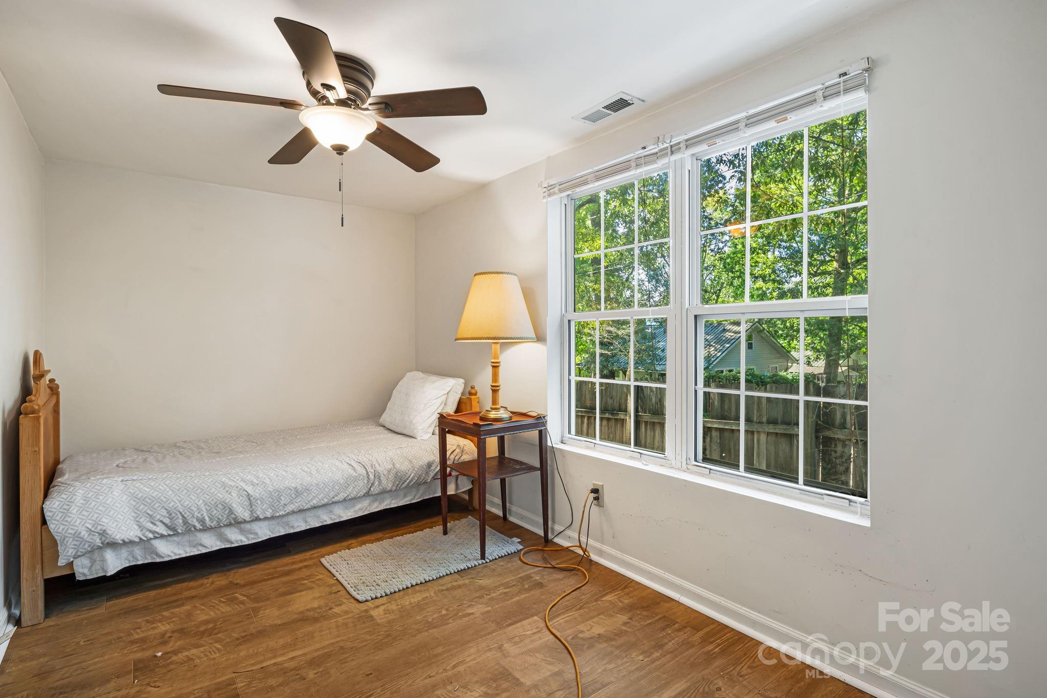609 Maple Street Brevard, NC 28712 - Photo 19 of 28 a bedroom with a bed and a large window