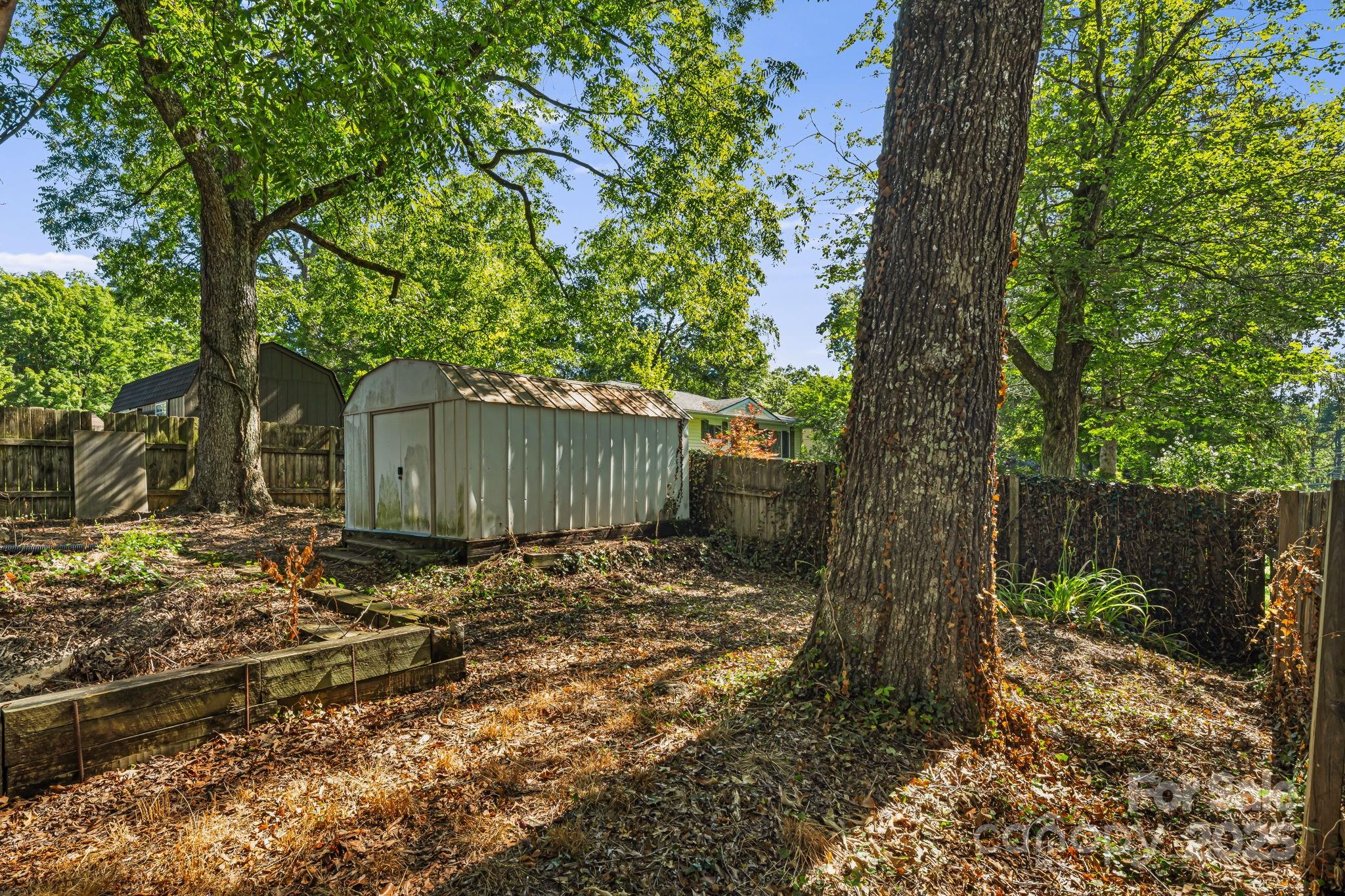 609 Maple Street Brevard, NC 28712 - Photo 23 of 28 a backyard of a house with lots of green space