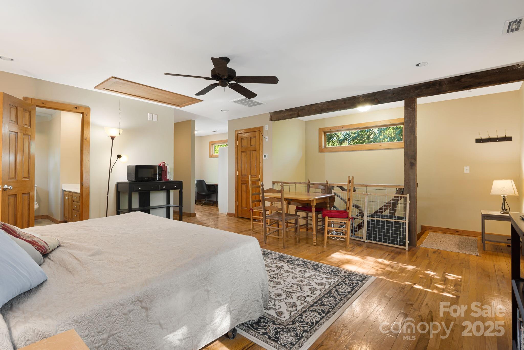 609 Maple Street Brevard, NC 28712 - Photo 5 of 28 a bed room with a bed and furniture