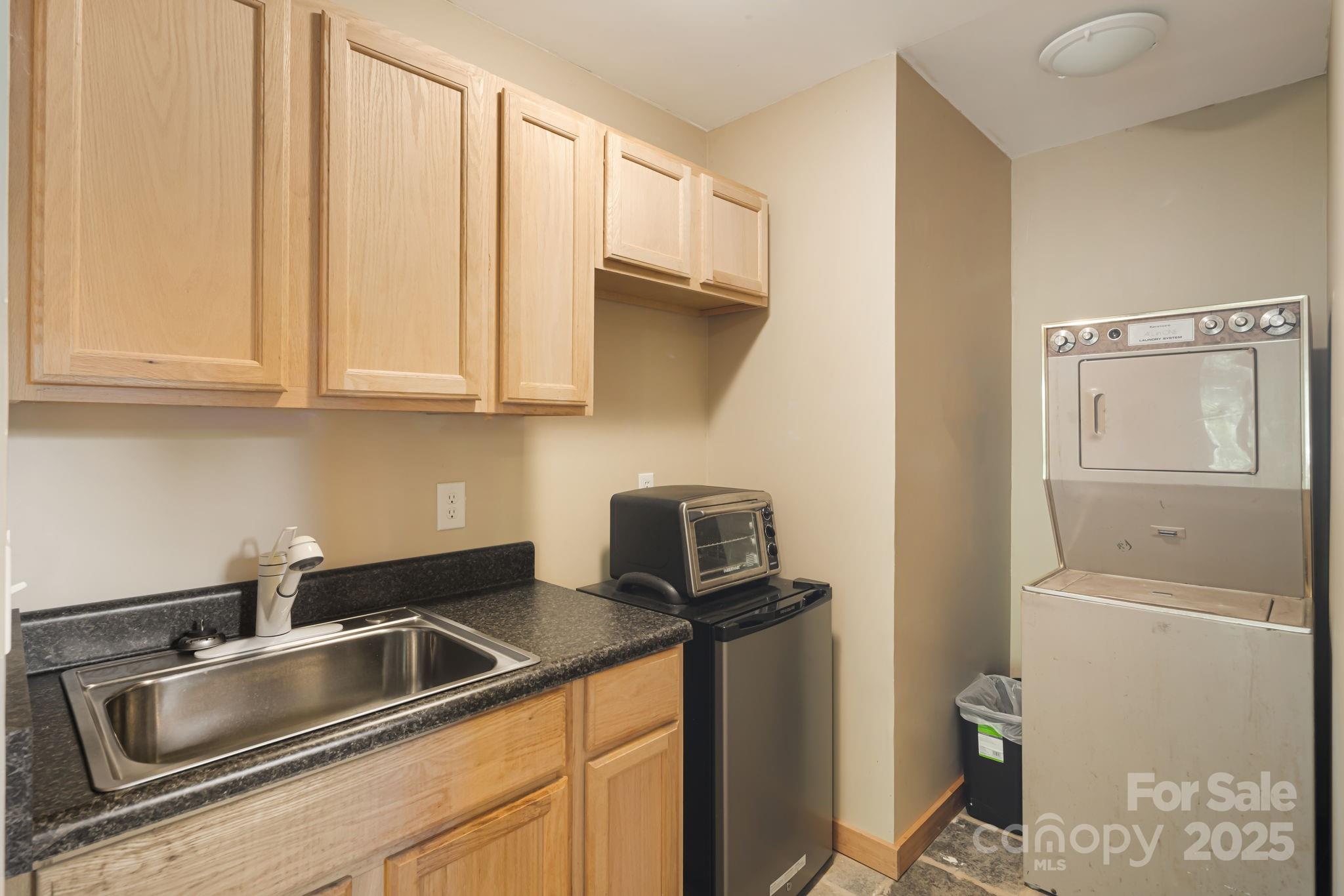 609 Maple Street Brevard, NC 28712 - Photo 7 of 28 a kitchen with a sink and cabinets