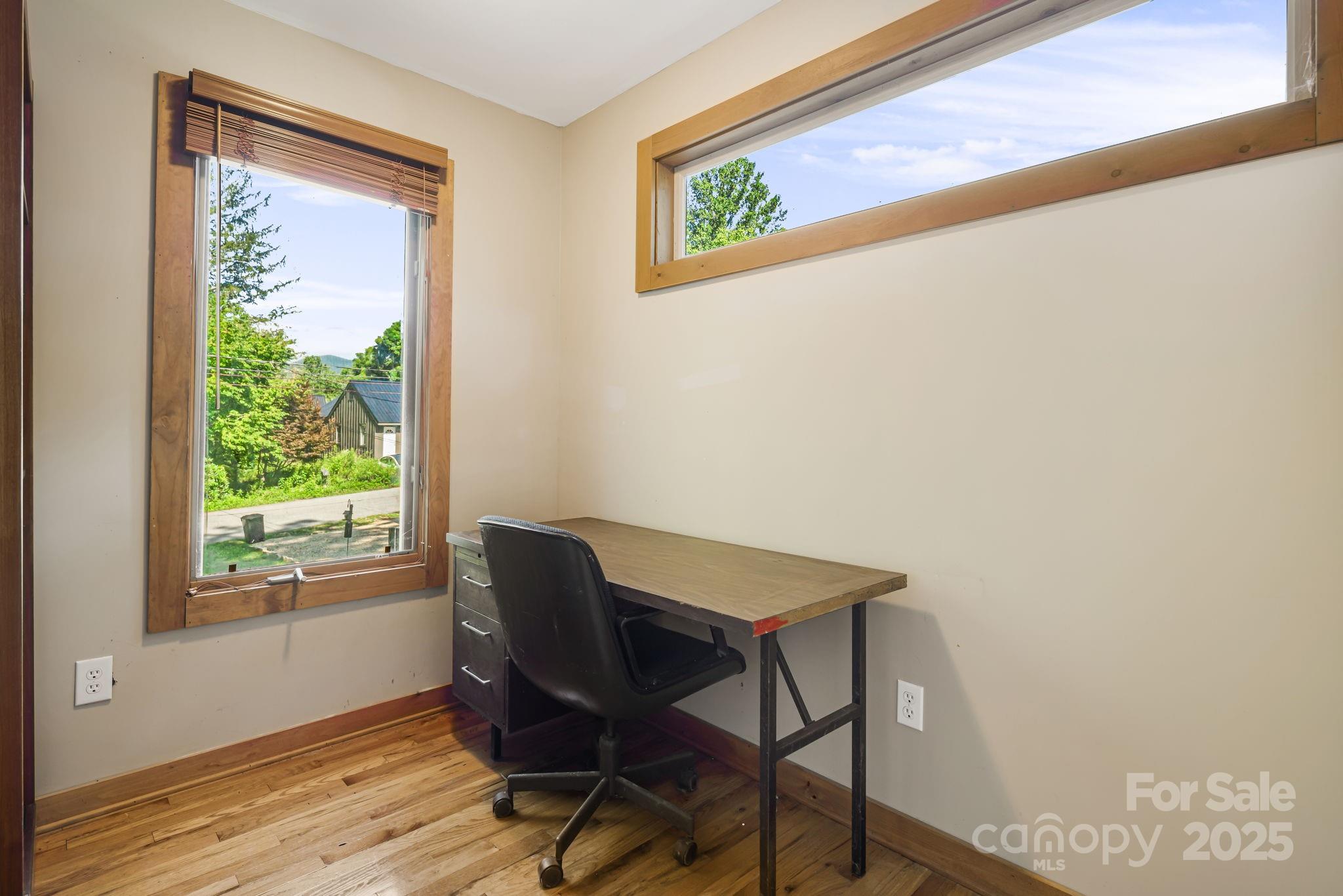609 Maple Street Brevard, NC 28712 - Photo 8 of 28 a view of a workspace with furniture and a window