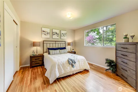a bedroom with a bed and a dresser