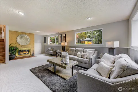 a living room with furniture and a rug