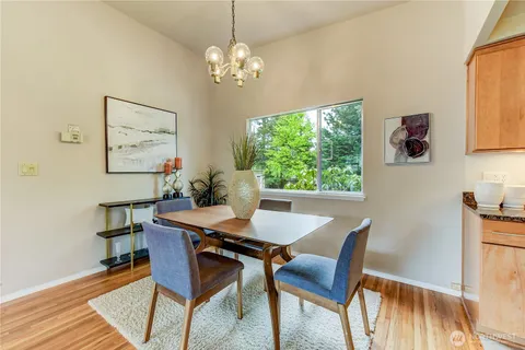 a view of a dining room with furniture window and outside view