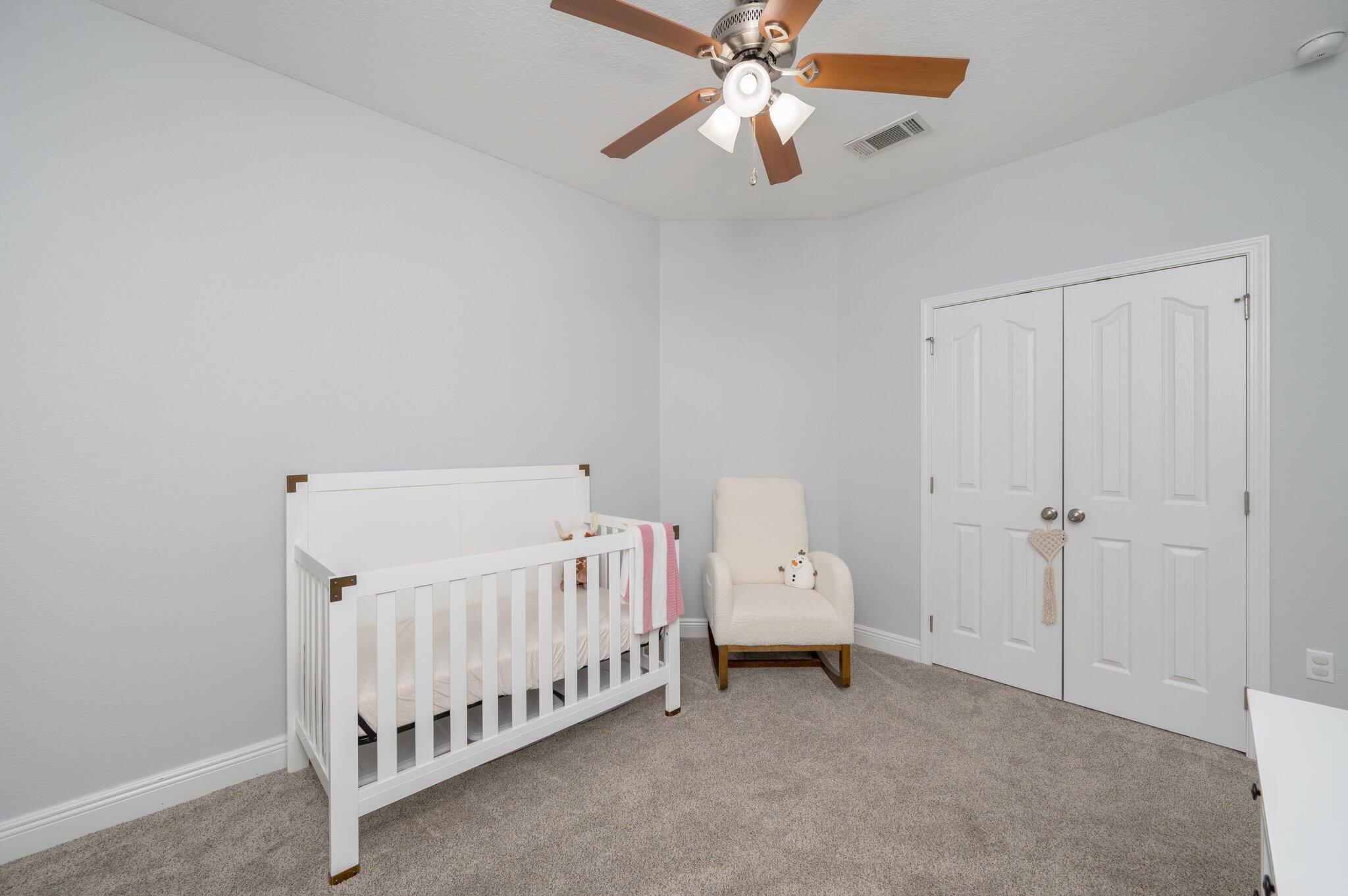 661 Red Fern Road Crestview, FL 32536 - Photo 12 of 28 a view of a room with racks on the wall