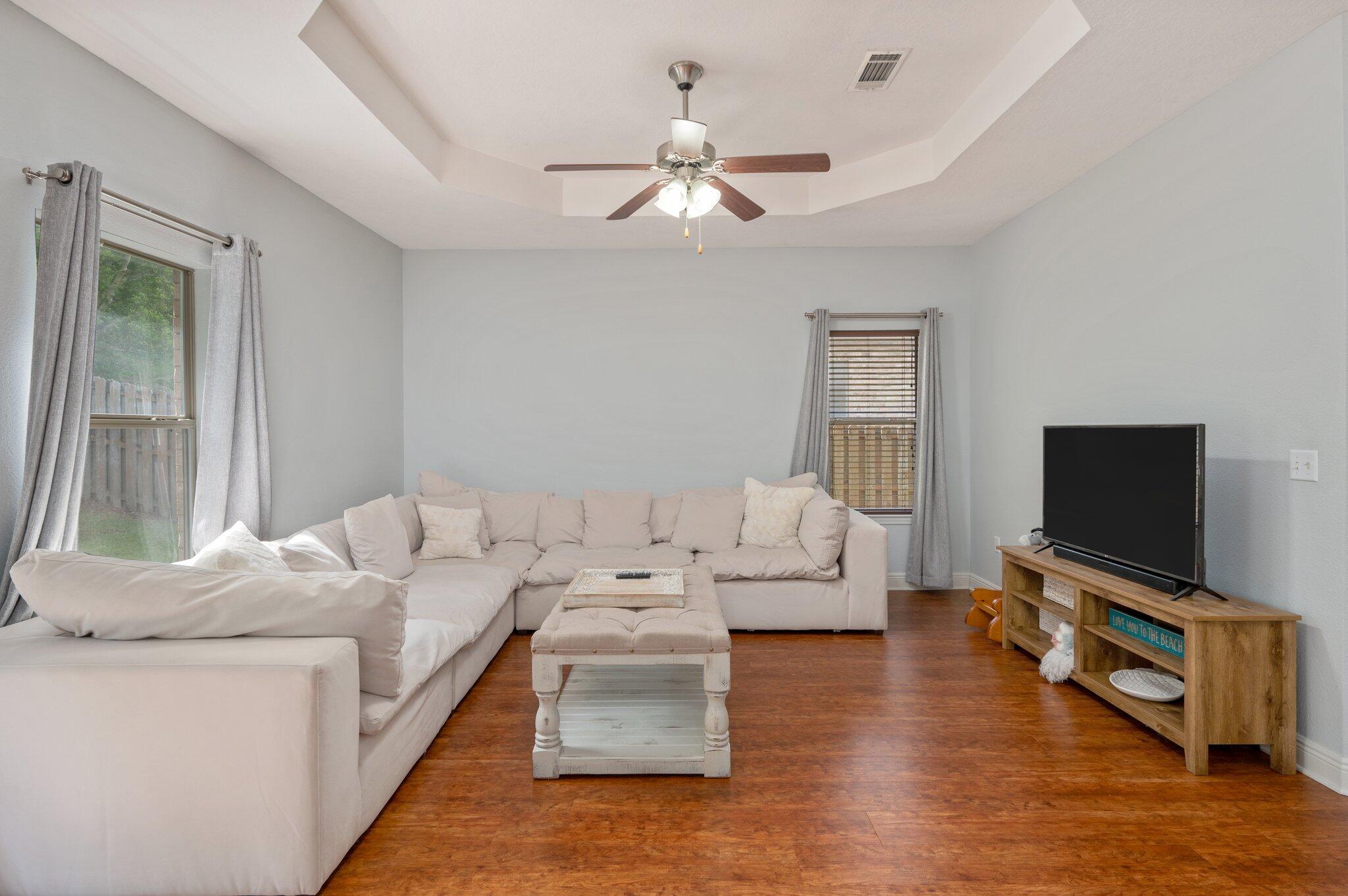 661 Red Fern Road Crestview, FL 32536 - Photo 2 of 28 a living room with furniture and a flat screen tv