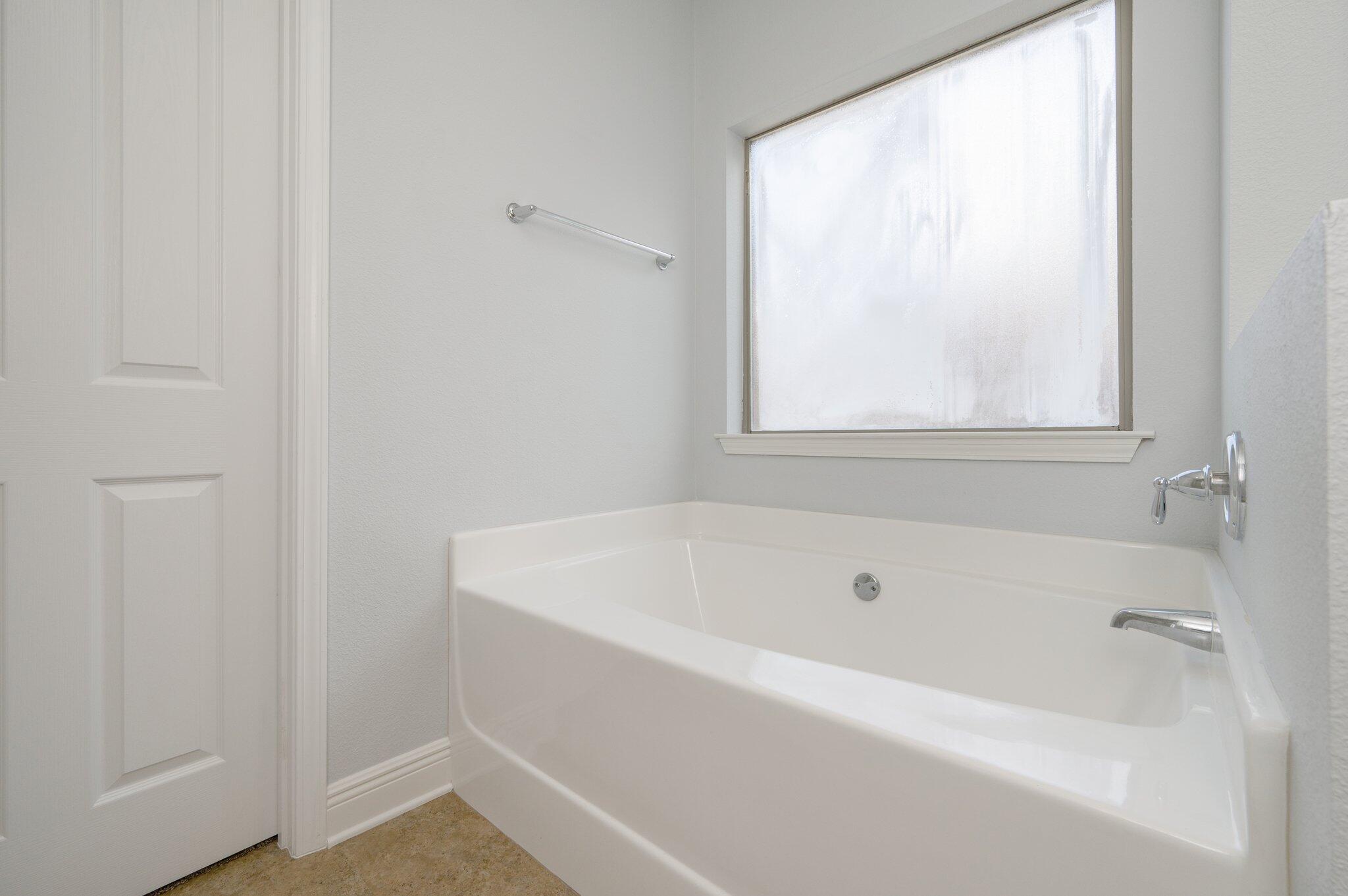 661 Red Fern Road Crestview, FL 32536 - Photo 21 of 28 a white bath tub sitting next to a window