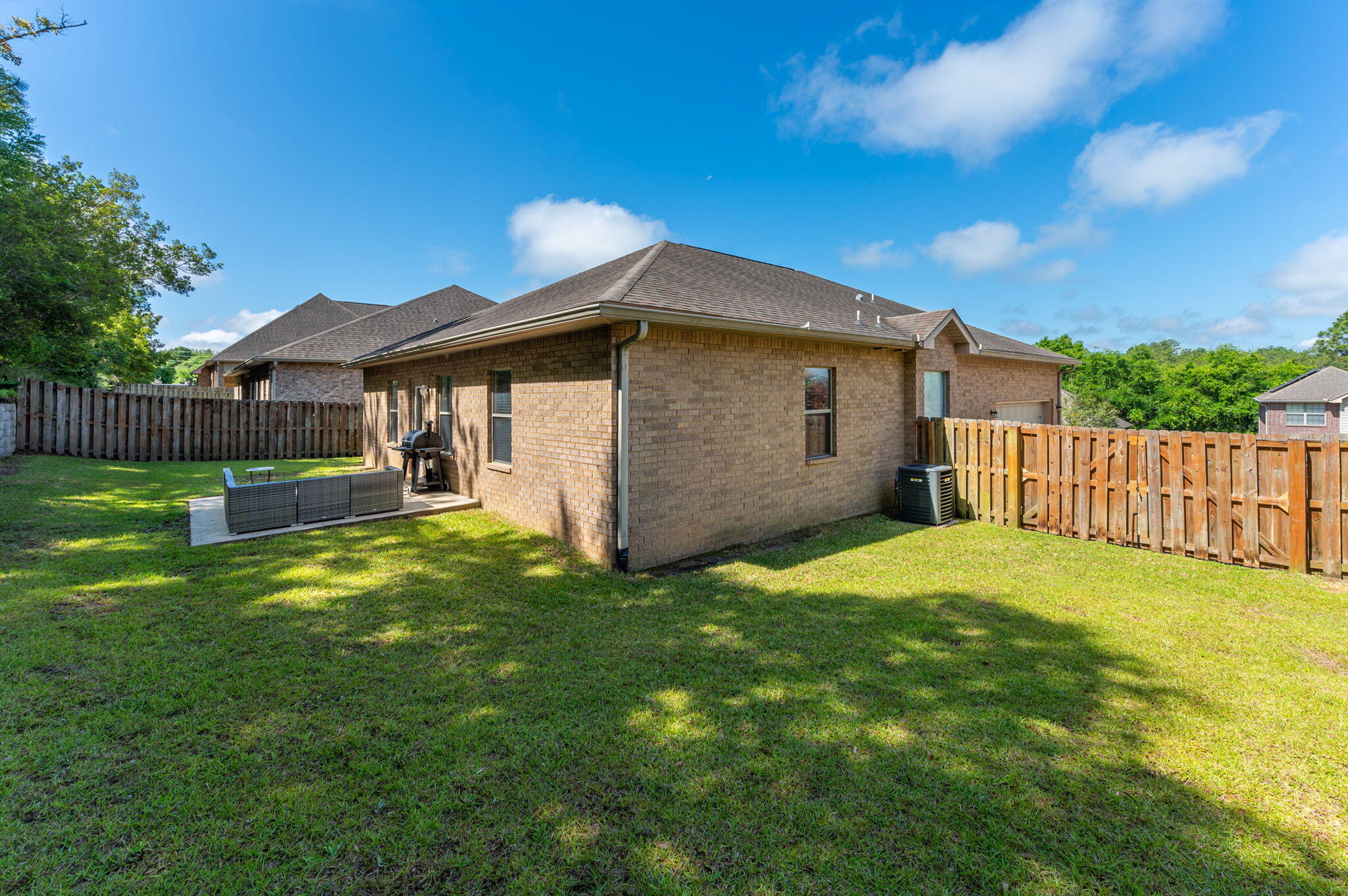 661 Red Fern Road Crestview, FL 32536 - Photo 27 of 28 a view of a house with a yard and wooden fence