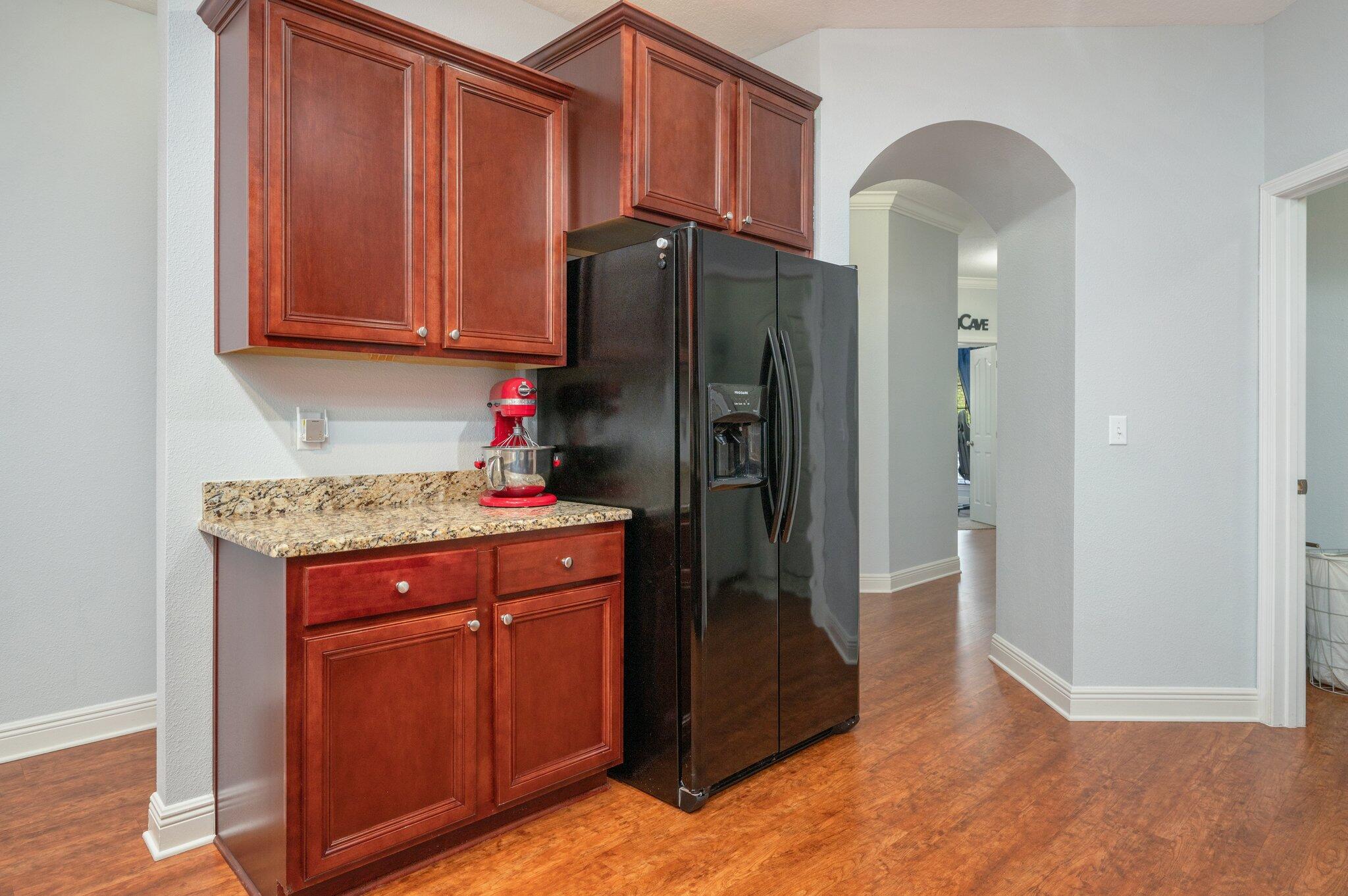 661 Red Fern Road Crestview, FL 32536 - Photo 9 of 28 a kitchen with stainless steel appliances granite countertop a refrigerator and a stove