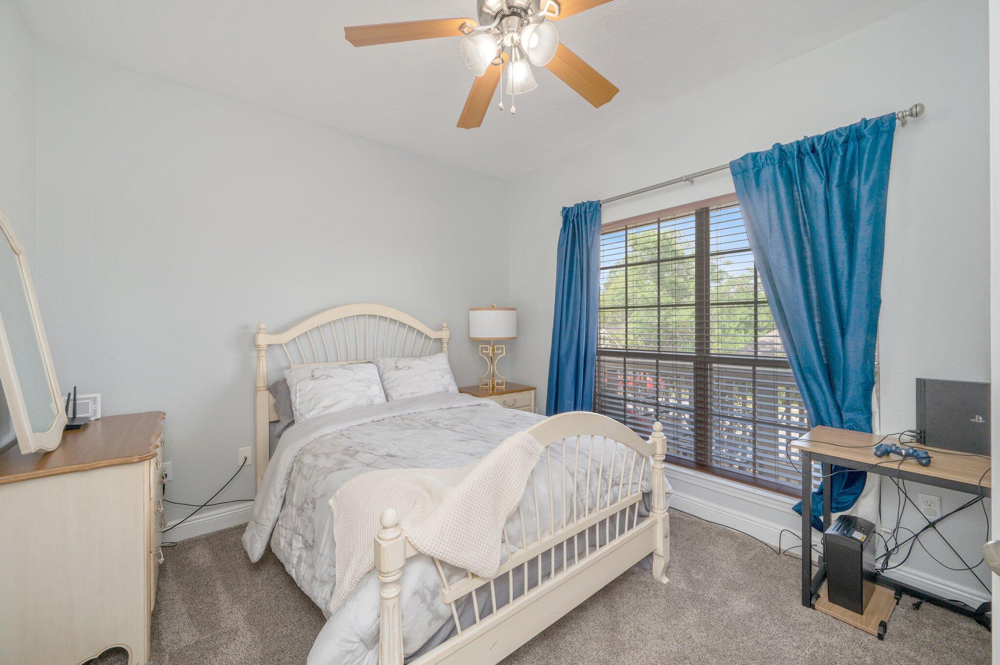 661 Red Fern Road Crestview, FL 32536 - Photo 10 of 28 a bedroom with a bed and a window