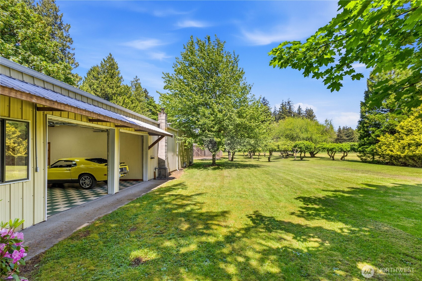 1788 Matz Road Ferndale, WA 98248 - Photo 28 of 40 a view of a patio with table and chairs a barbeque and a large tree