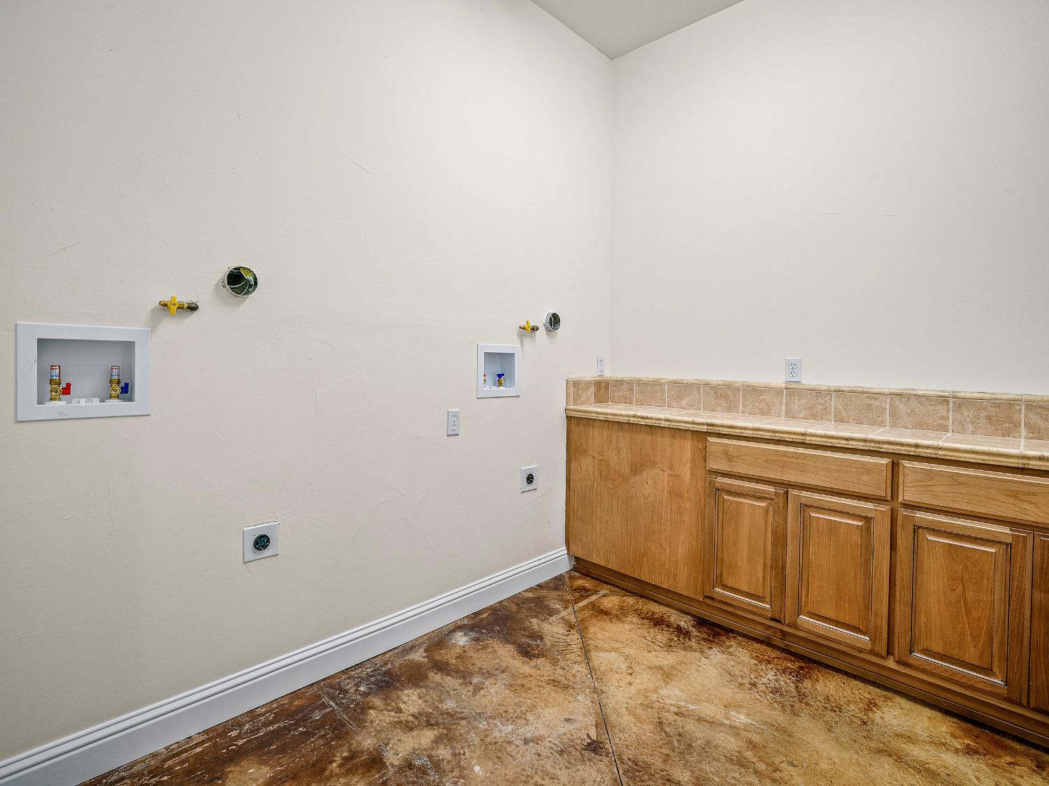 7055 Ridge Road Newcastle, CA 95658 - Photo 23 of 58 Main-floor laundry room with ample space for two stackable washer and dryer units.