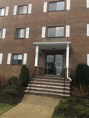 a view of a brick building with many windows