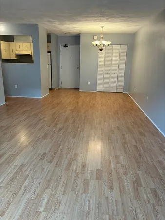 a view of a livingroom with wooden floor