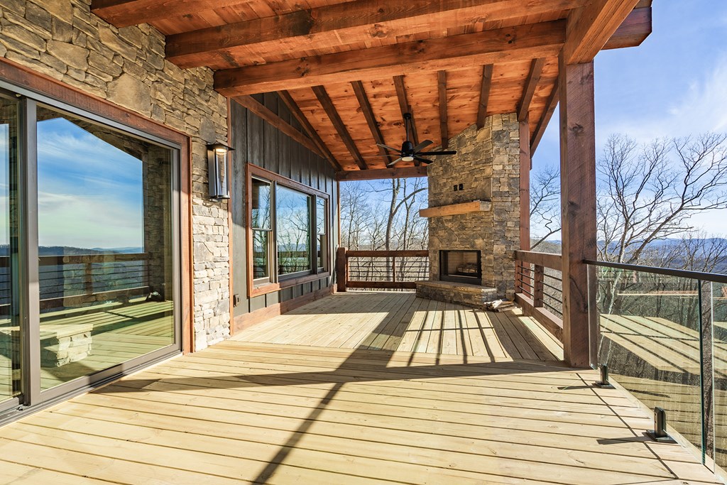 925 Heards Ridge Morganton, GA 30560 - Photo 12 of 70 a view of a balcony with wooden floor and iron stairs