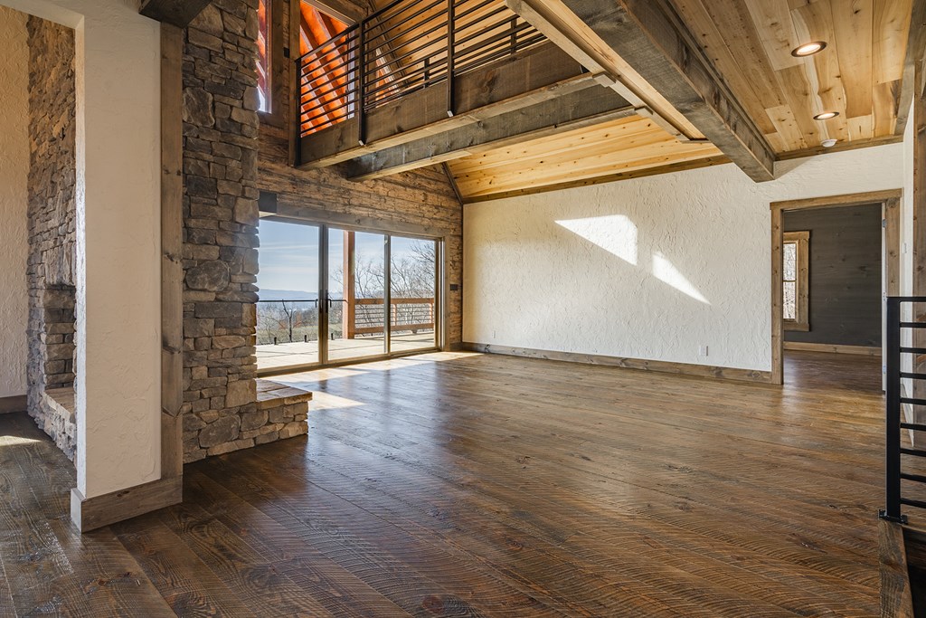 925 Heards Ridge Morganton, GA 30560 - Photo 16 of 70 an empty room with wooden floor and windows