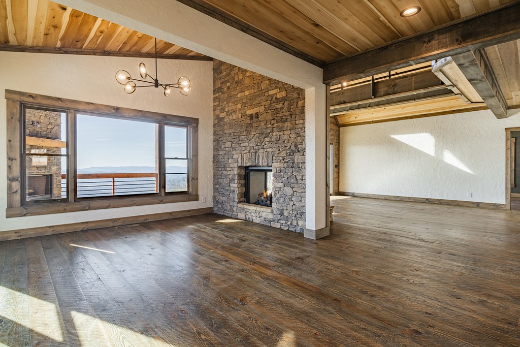 925 Heards Ridge Morganton, GA 30560 - Photo 17 of 70 a view of empty room with wooden floor and fireplace