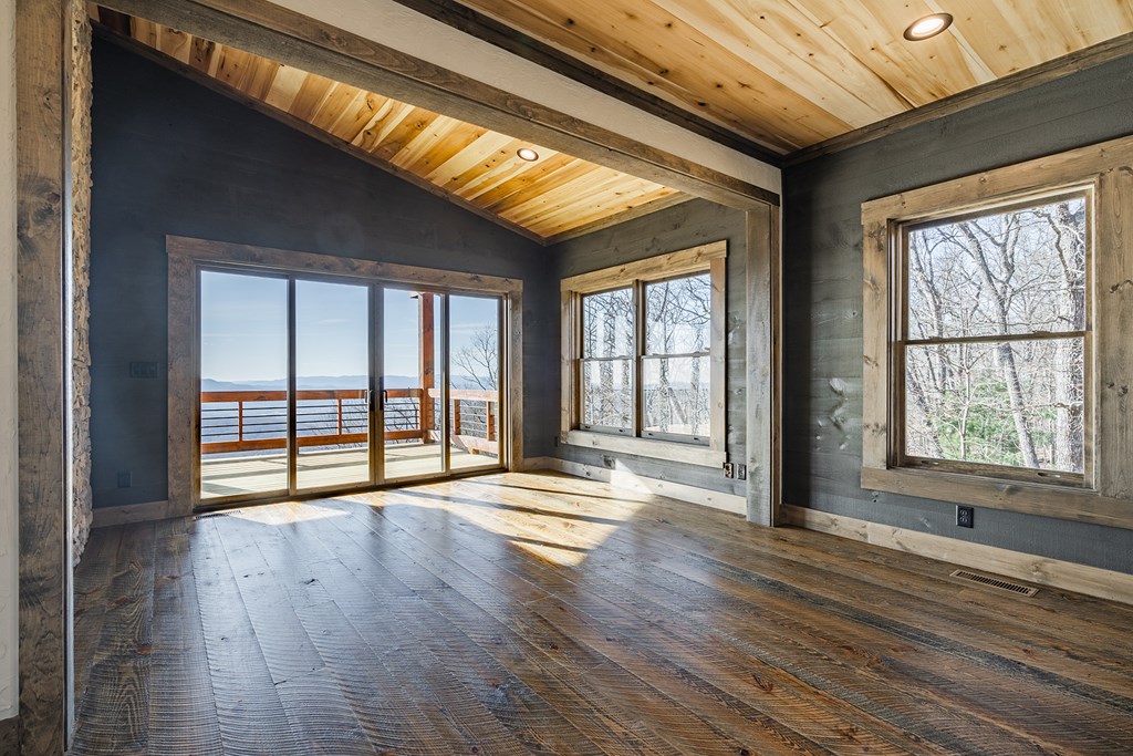925 Heards Ridge Morganton, GA 30560 - Photo 26 of 70 a view of an empty room with wooden floor and a window