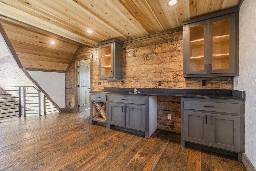 925 Heards Ridge Morganton, GA 30560 - Photo 38 of 70 a kitchen with granite countertop wooden floors and sink