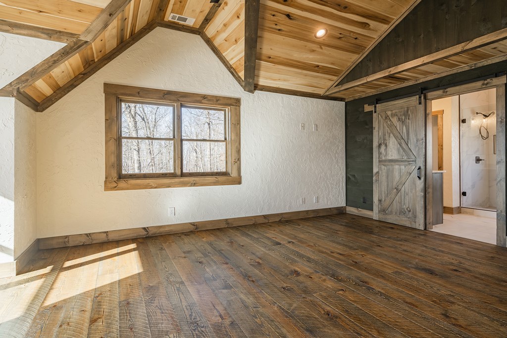 925 Heards Ridge Morganton, GA 30560 - Photo 40 of 70 a view of an empty room with wooden floor and a window