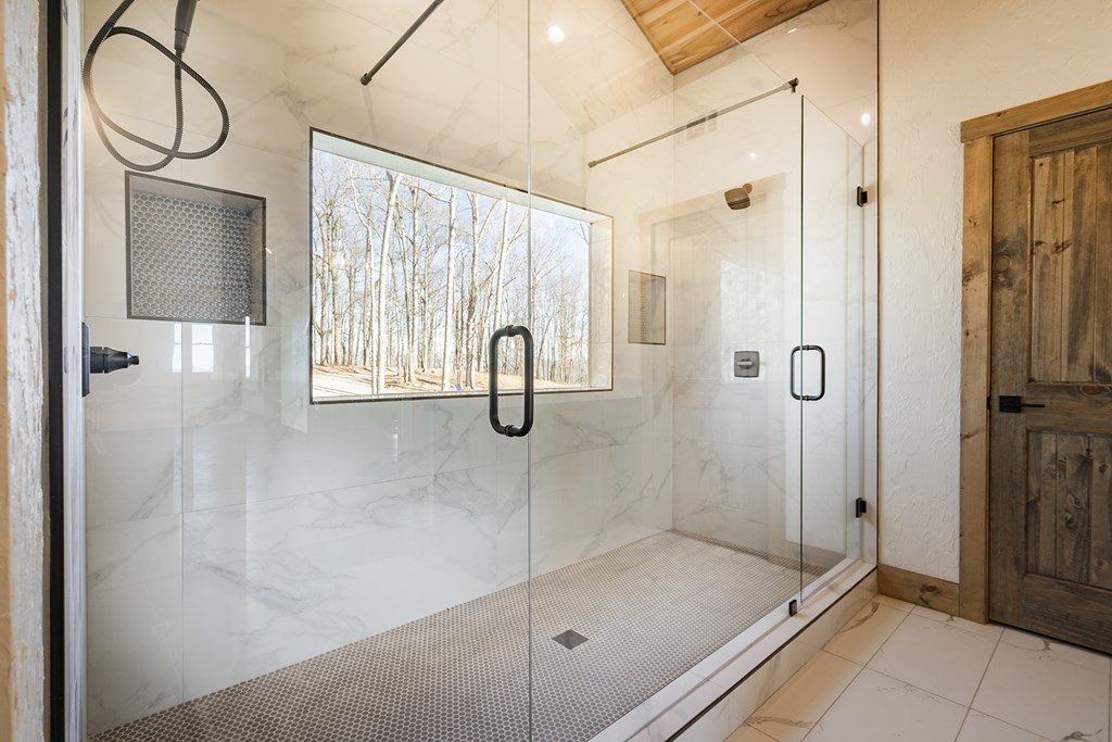 925 Heards Ridge Morganton, GA 30560 - Photo 43 of 70 a bathroom with a shower and a sink