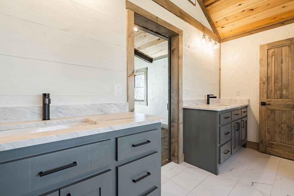 925 Heards Ridge Morganton, GA 30560 - Photo 45 of 70 a bathroom with a granite countertop sink mirror and