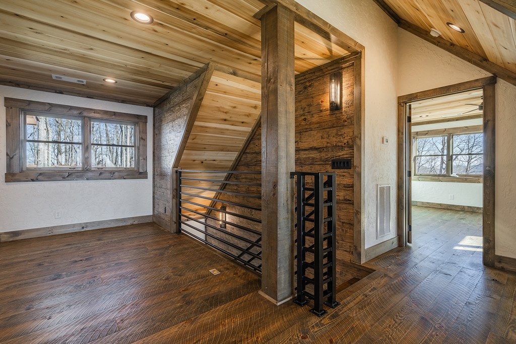 925 Heards Ridge Morganton, GA 30560 - Photo 46 of 70 wooden floor in an empty room with a window