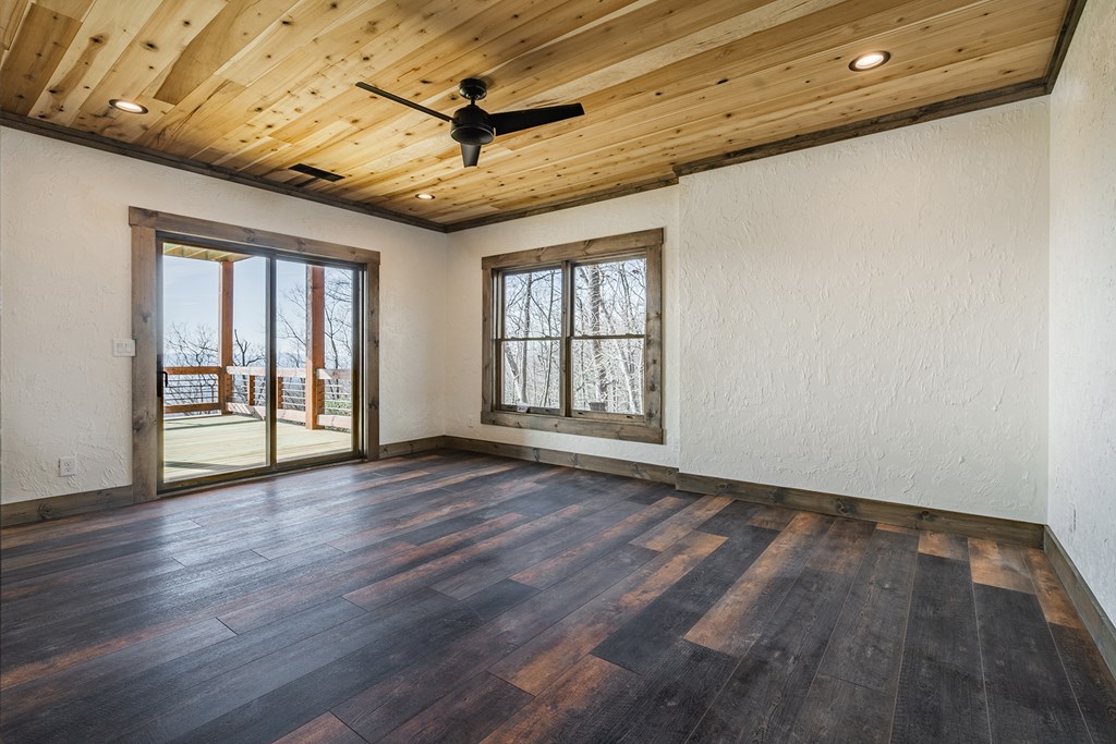 925 Heards Ridge Morganton, GA 30560 - Photo 57 of 70 a view of an empty room with a window and wooden floor
