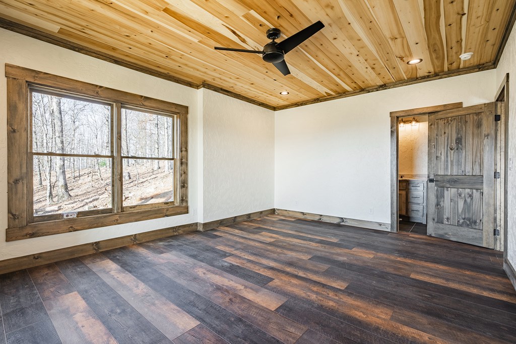 925 Heards Ridge Morganton, GA 30560 - Photo 58 of 70 a view of an empty room with wooden floor and a window