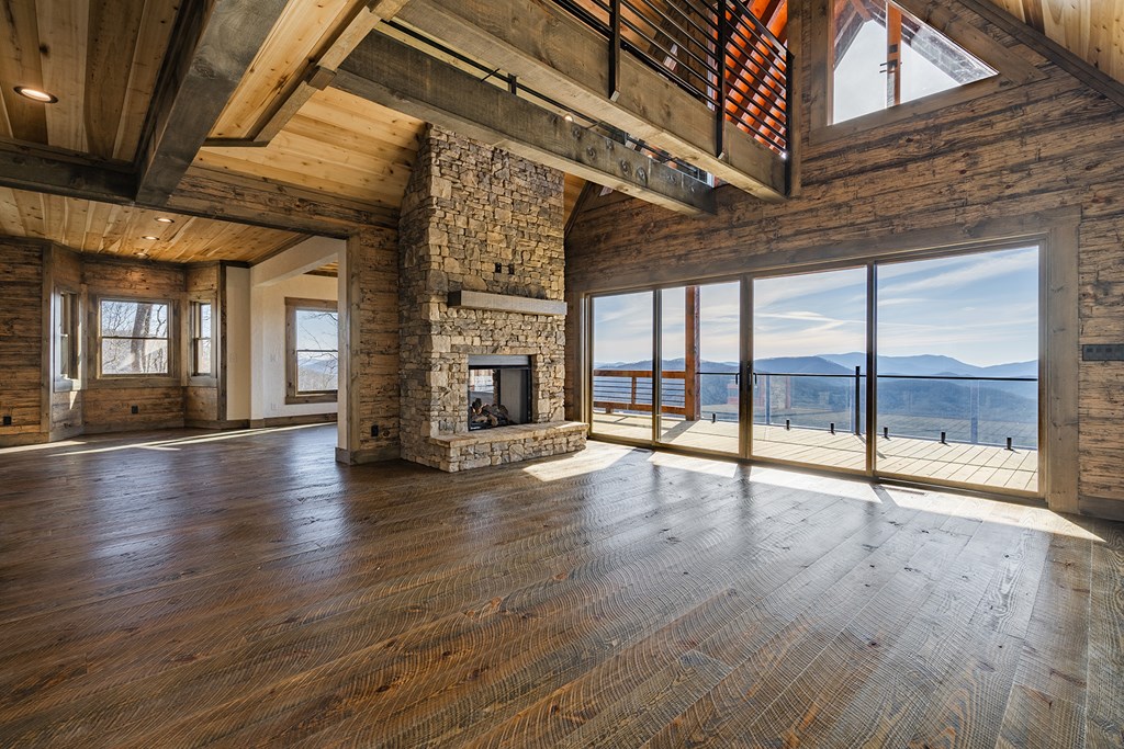925 Heards Ridge Morganton, GA 30560 - Photo 6 of 70 a view of an empty room with wooden floor and a window