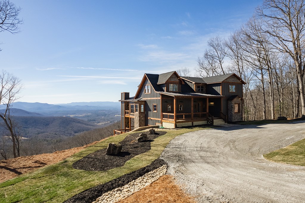 925 Heards Ridge Morganton, GA 30560 - Photo 9 of 70 a wooden bench sitting in the middle of a yard