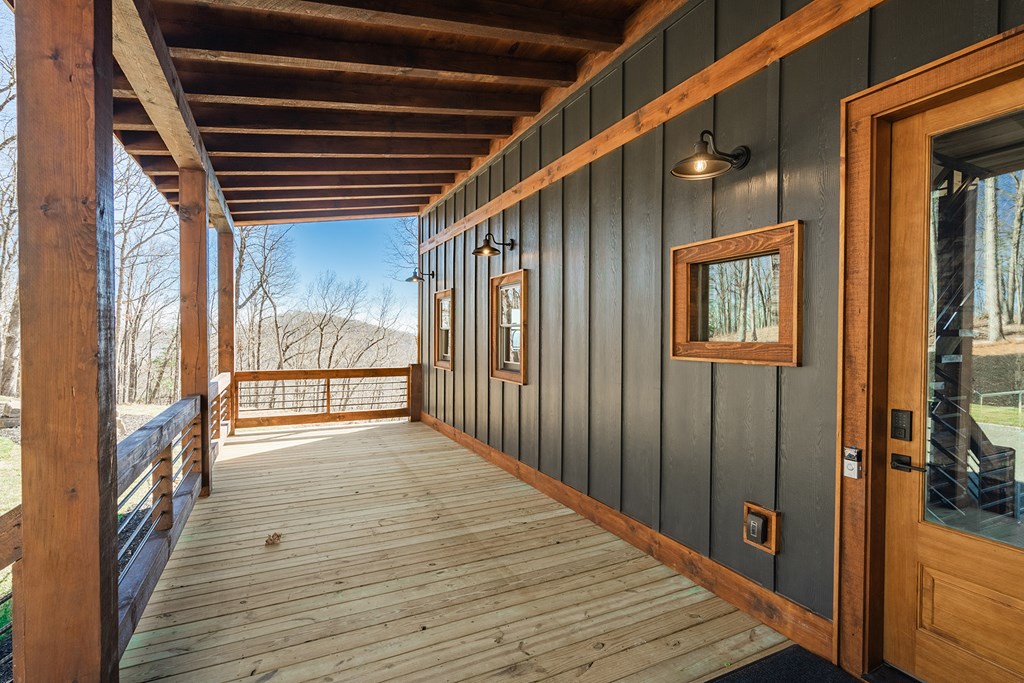 925 Heards Ridge Morganton, GA 30560 - Photo 10 of 70 a view of a porch with wooden floor and windows