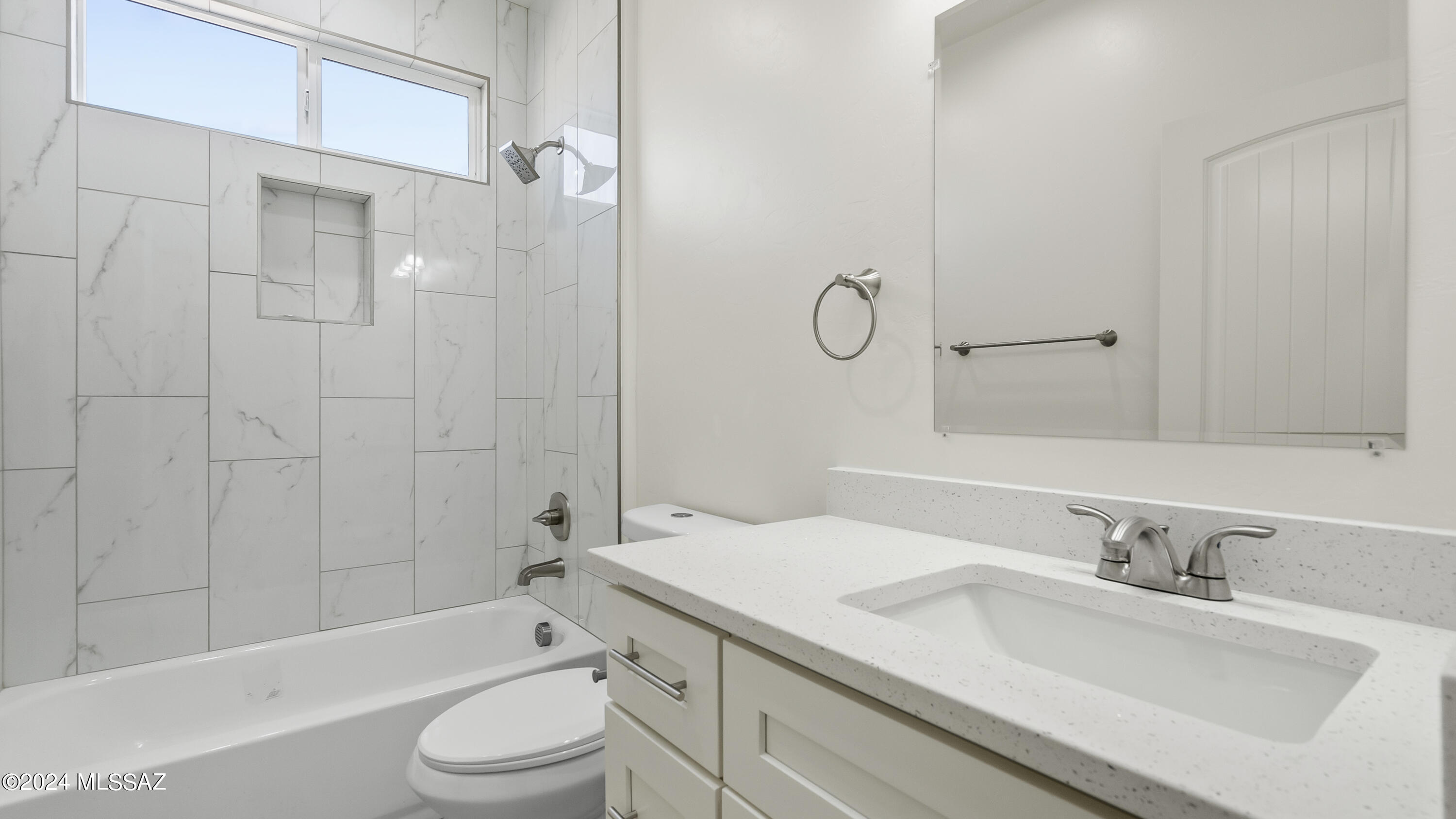 1817 Vereda Iberia Rio Rico, AZ 85648 - Photo 18 of 25 a bathroom with a granite countertop sink toilet and shower
