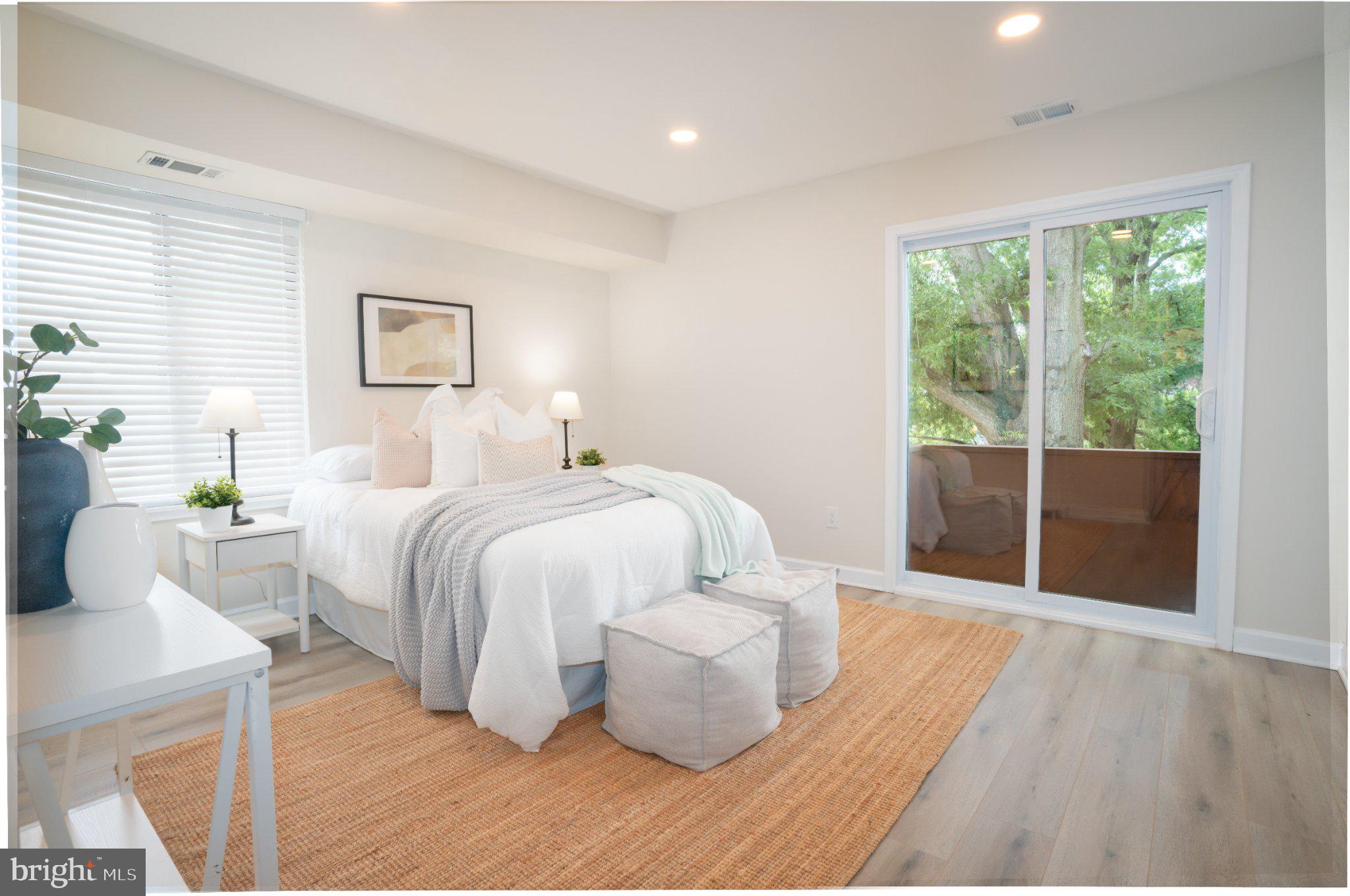 5860 Thunder Hill Road, Unit C1 Columbia, MD 21045 - Photo 5 of 22 Serene bedroom with nature views.