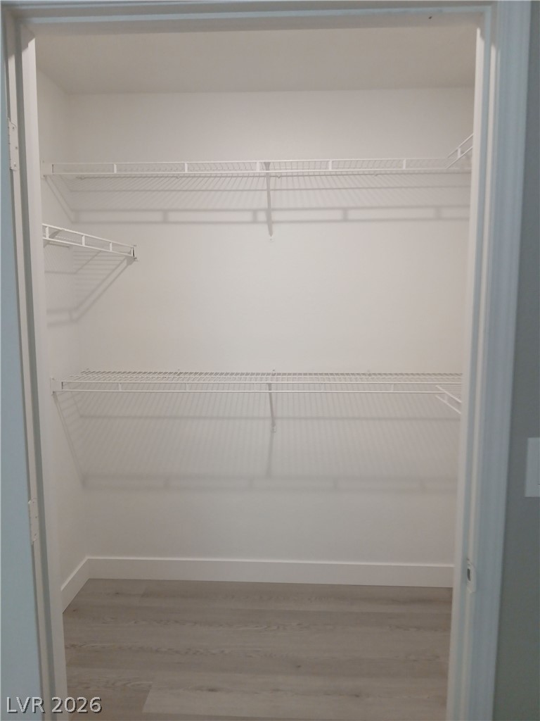 555 East Silverado Ranch Boulevard, Unit 1098 Las Vegas, NV 89183 - Photo 7 of 10 Ample wire shelving provides practical storage in this well-appointed closet.